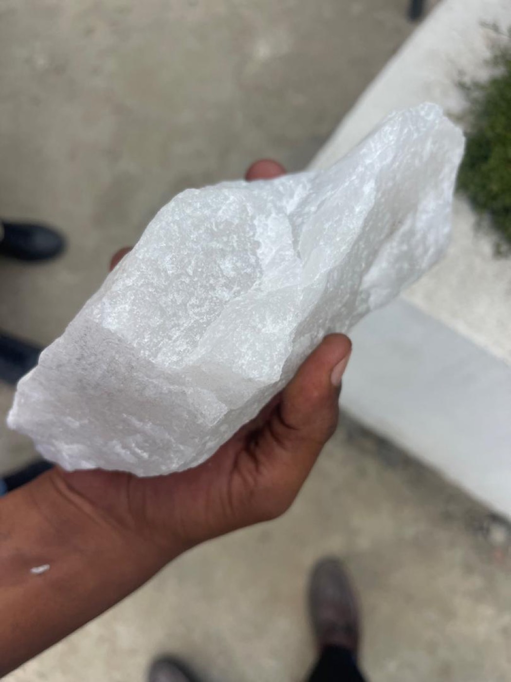 Raw silica quartz chunk in hand, flagship product